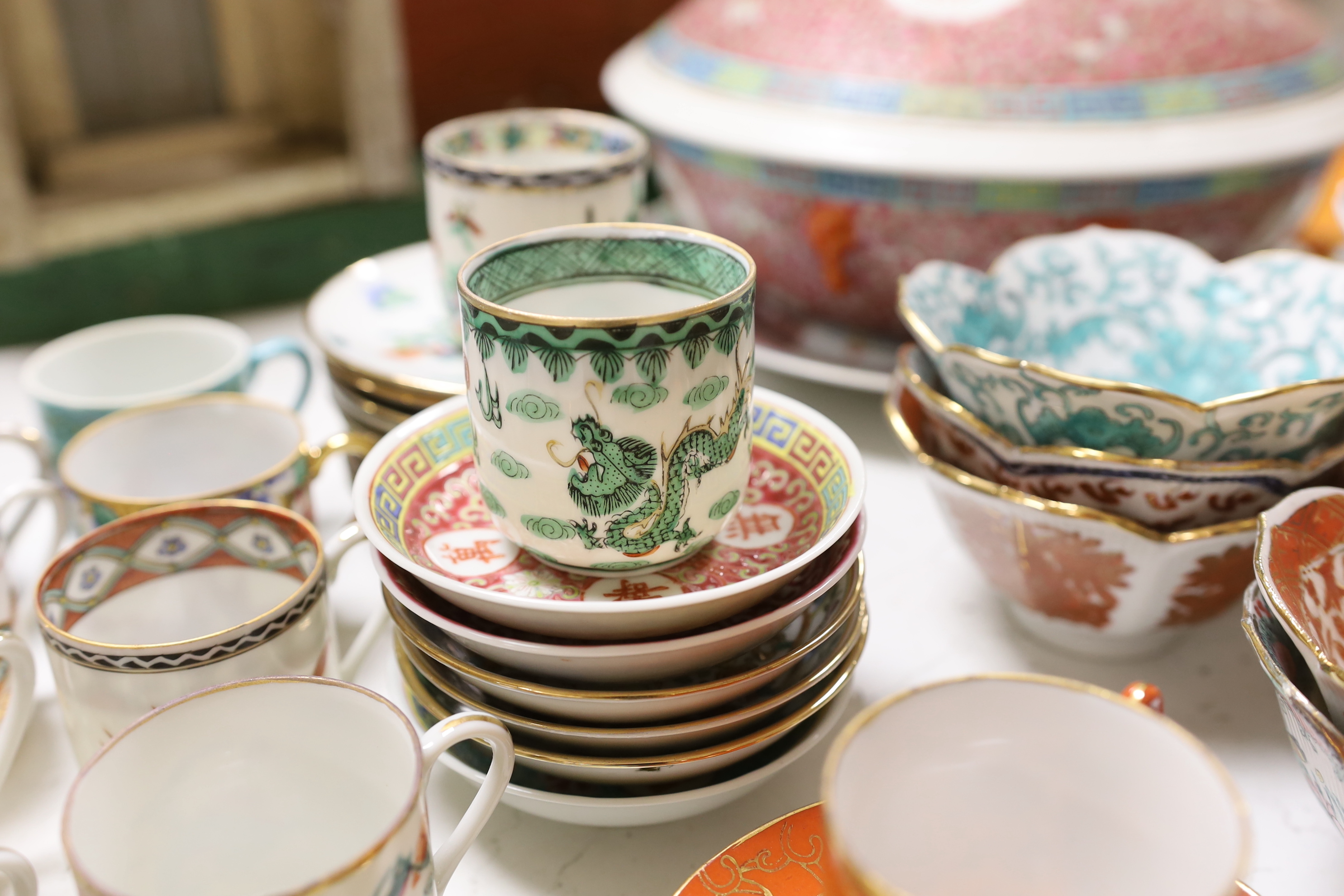 A group of Chinese enamelled porcelain coffee cups and saucers, and similar petal lobed bowls, mid 20th century